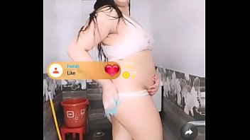 a hairy cute girl stripping and masturbating while take a bath