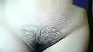 a hairy cute girl stripping and masturbating while take a bath