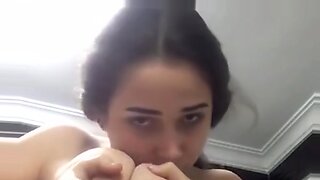 girl sucking own boobs