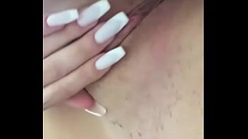 teasing brunette rubbing big natural boobs